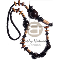 brown kukui nuts with bamboo tube with