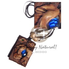 clay tribal mask on 60mmx40mm rectangular driftwood with gemstone