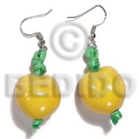 dangling yellow kukui nuts with green ribbon accent